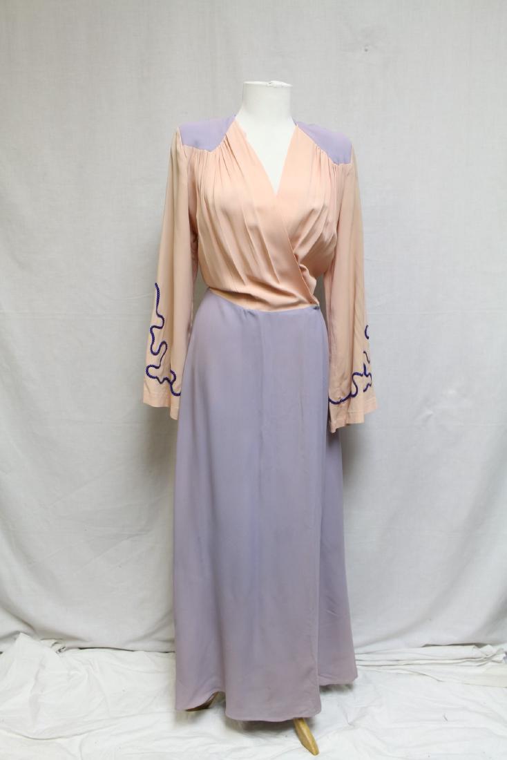 1940s Sally Lynn of Hollywood Dressing Gown: Rayon fabric, good condition, mild fading of the purple color that looks intentional, small fray on seam behind left arm, small spot on front lapel, missing belt. 29" waist/ 36" bust.
