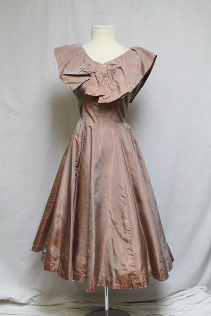 1950s Blush Sharkskin Dress: Blush sharkskin taffeta fabric. Good condition, minor seam stresses, a few very light small spots. 38" bust/29" waist.