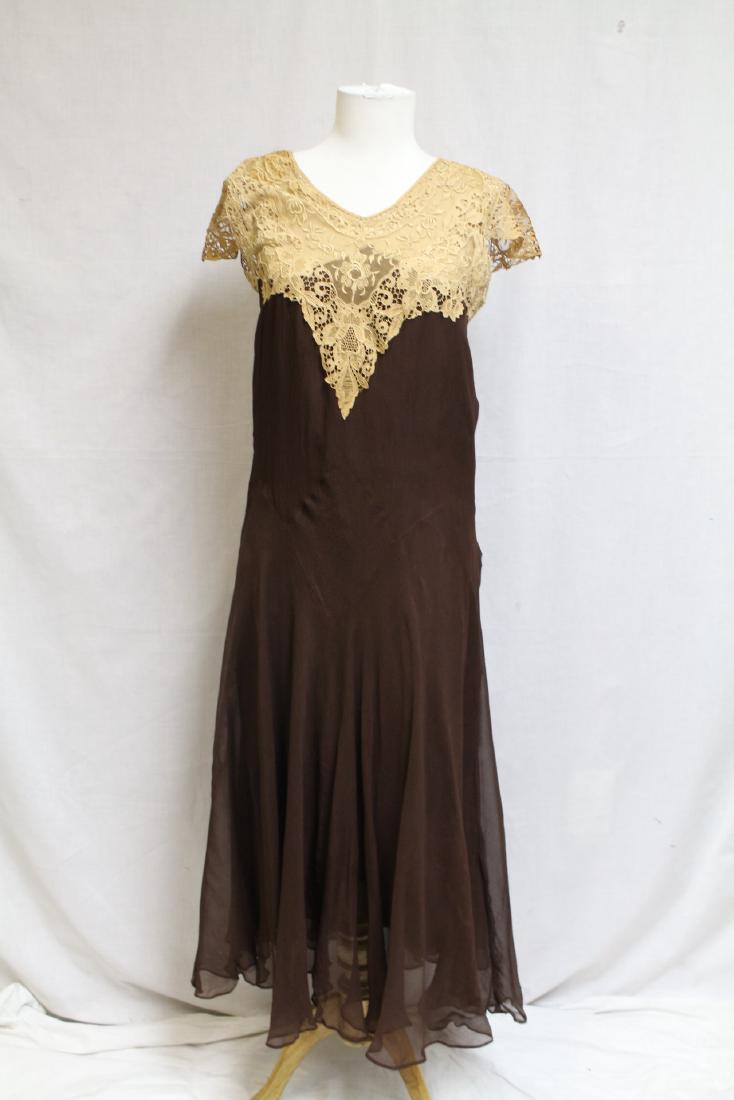 1920s Brown Chiffon Dress: Lace bodice and sleeves, silk lining. Missing belt. Good condition, a few very light water spots, silk lining has lots of splits. 33" bust/50" length.