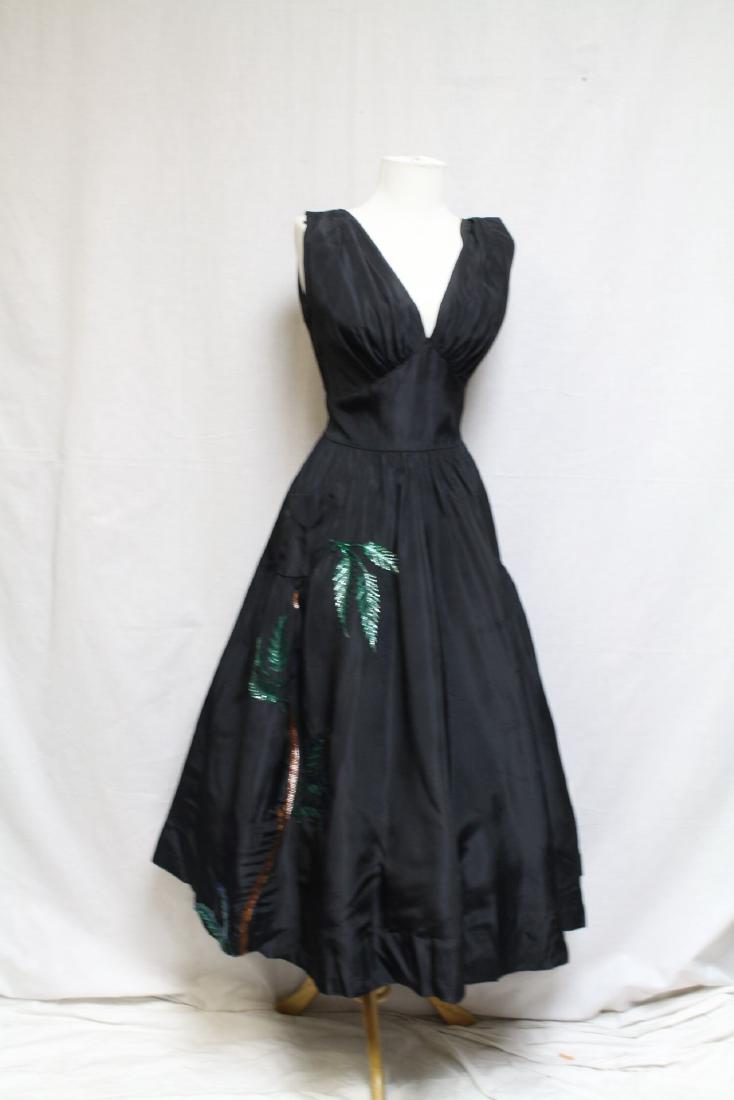 1940s Foxbrow Dress: Rayon taffeta fabric, sequined palm tree appliques. Good condition, a few tiny frays on fabric throughout, a few very light spots, back darts have been opened. 36" bust/28" waist.