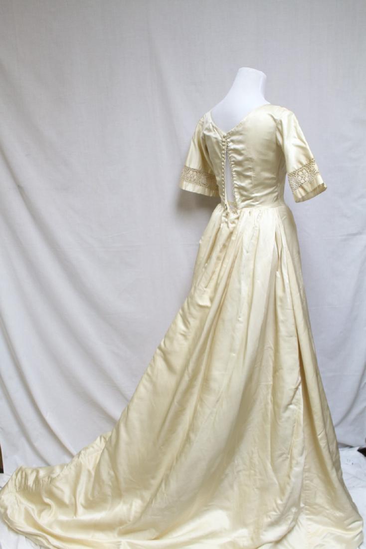 1960s Silk Wedding Gown: Silk fabric, tatted lace inset sleeves, fully lined. 32" bust/24" waist. Fair/good condition with multiple light spots, back darts taken out.
