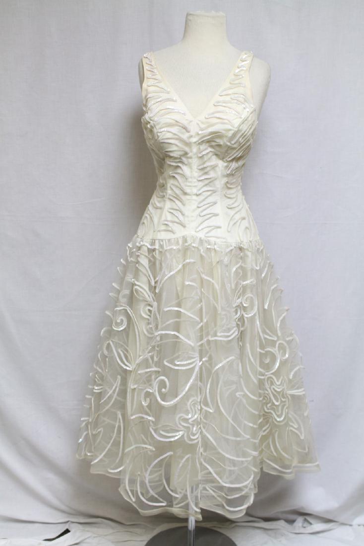 1950s Paula Lynne Dress: Sequined net fabric, taffeta lining. 34" bust/26" waist.