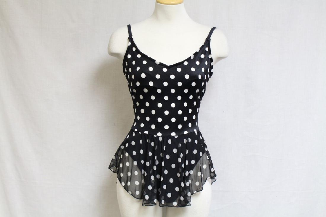 Vintage 1980s Polka Dot Skirted Swimsuit: lycra/nylon fabrics, good condition, neckline slightly stretched. 36 bust/28-34 length
