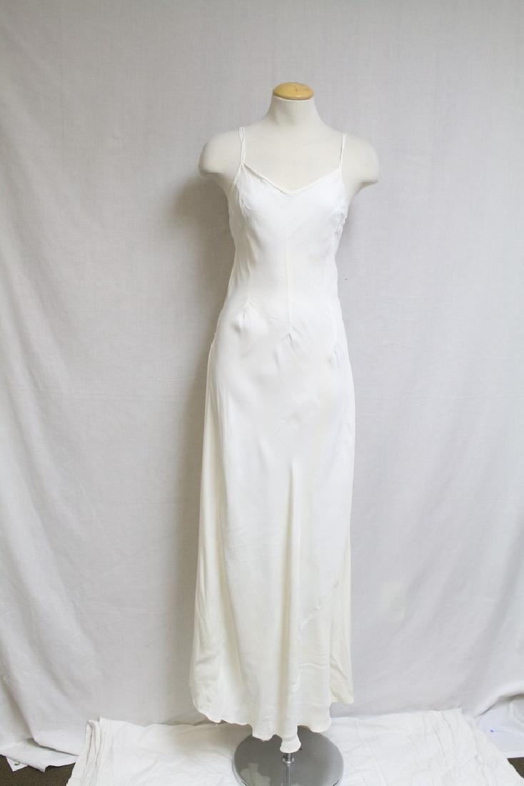 Vintage 1940's Ivory Rayon Floor Length Slip: cold rayon and rayon crepe de chine fabrics, good condition with several small light spots and seam stresses. 36 bust/63 length (slightly trained)