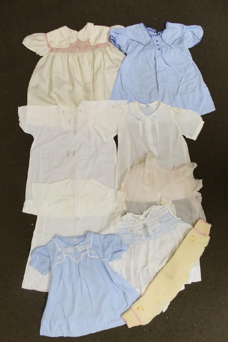Vintage Lot of 1930s Baby Clothing: eight dresses and one knit shrug - silk, organdy, cotton fabrics and wool knit. Good to great condition with a few tiny and light spots, and loose seams.