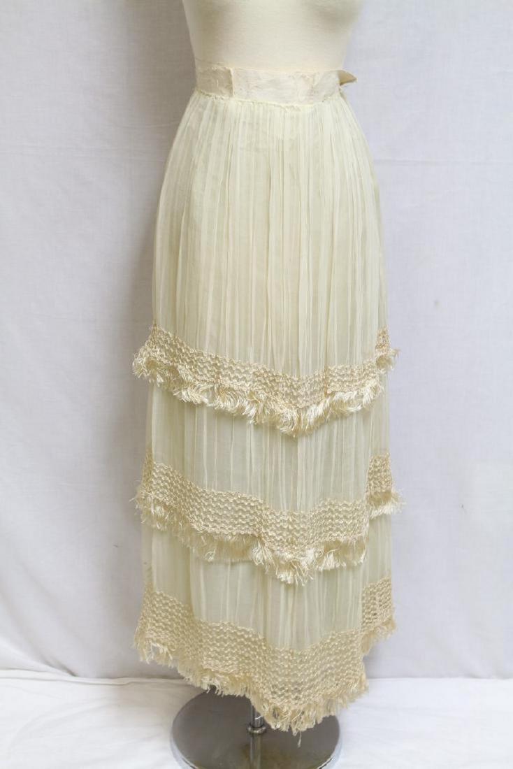 Antique Edwardian Silk Skirt: Silk chiffon fabric, with silk fringe. Spotting throughout, silk lining has many holes. 28" waist/40" length.