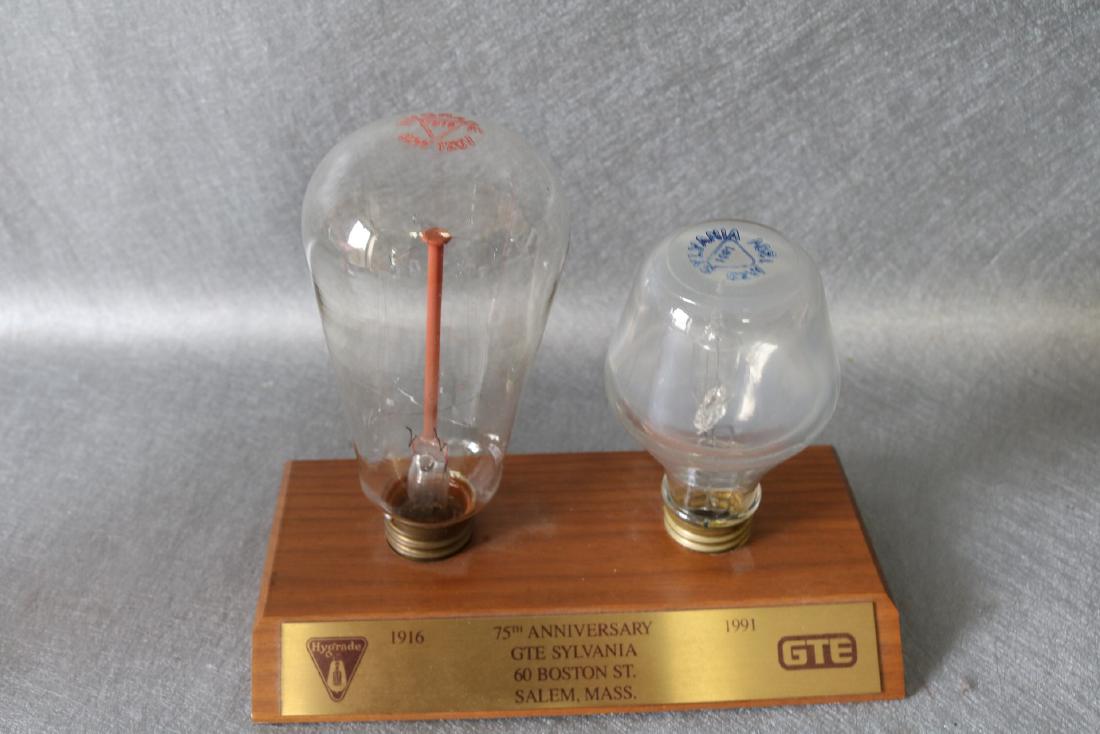 GTE Sylvania 75th Anniversary award with Light Bulbs: 1916 Hygrade 60 w bulb and 1991 Sylvania 52 w bulb with plaque