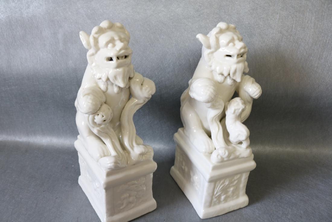 Pair of Vintage White Porcelain Foo Dogs: each slightly different, Open mouths, great condition, approx. approx. 11 inches tall