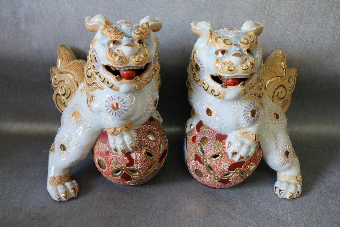 Pair Mid-Century Japanese Satsuma Foo Dogs: mid 1950's Open mouth foo dogs on ball, great raised hand painted detail, approx. 10 inches tall