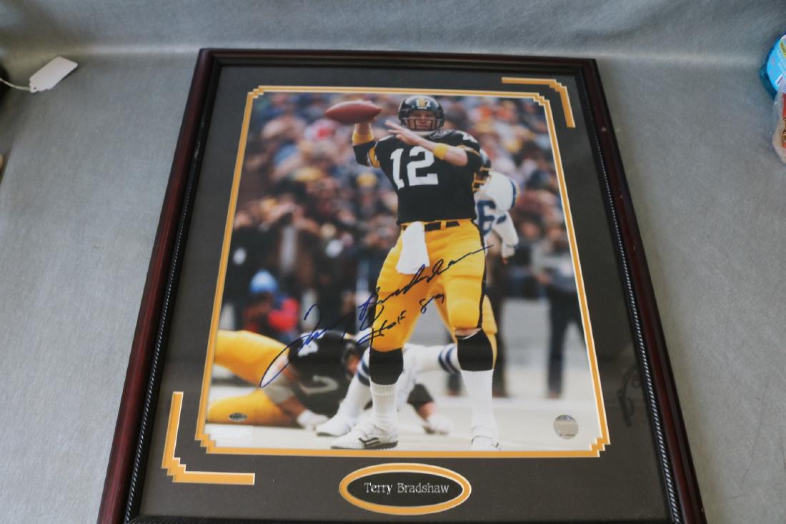 Terry Bradshaw Autographed Poster: with official seals, in frame approx. 22 1/2 x 26 1/2