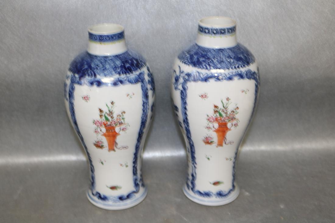 Pair Qian Long Chinese Export Vases: hand painted, holes in bottom, may have been lamps at one time. approx. 10 inches tall, see photo's for damage and repair
