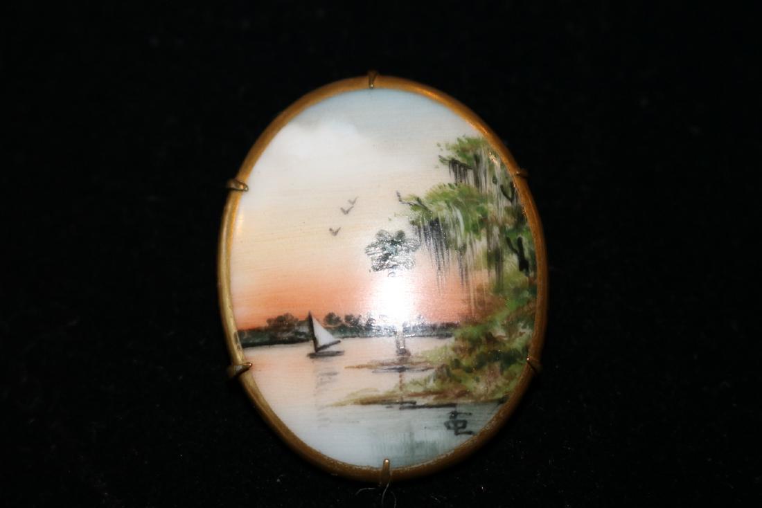 Victorian Hand Painted seascape Brooch: scenic seascape Porcelian hand painted and signed in lower corner, framed in gold tone, approx. 1 1/2 inches