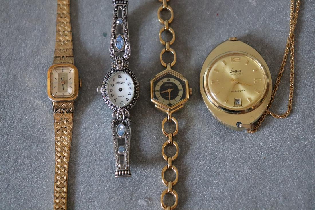 Vintage Lot of 4 Watches: Goldtone Sheffield calendar watch pendant, Lorus goldtone chain watch, Timex goldtone watch, L.A. Express Marcasite watch, all in great condition