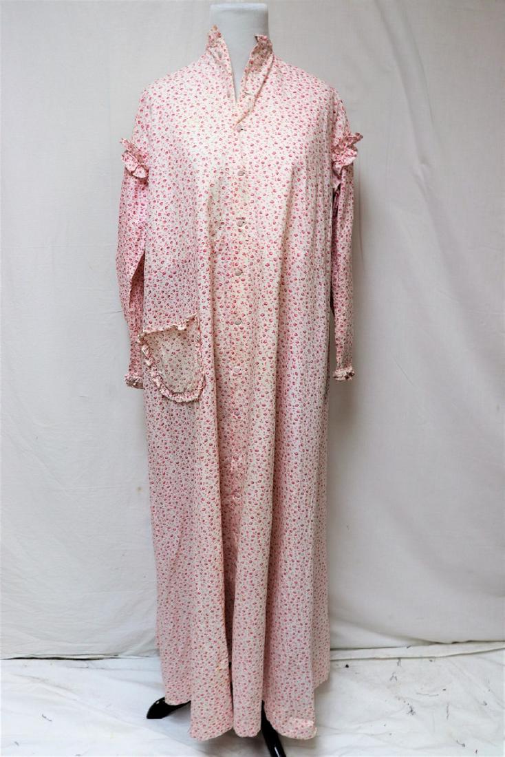 1880's Morning Wrapper, Pink Calico, Ceramic Buttons: Pink calico wrapper, robe with dainty printed ceramic or glass buttons. Measures 46" at bust and 23" across shoulders. Few small holes, light soil, one pocket missing in front, the other needs to be t