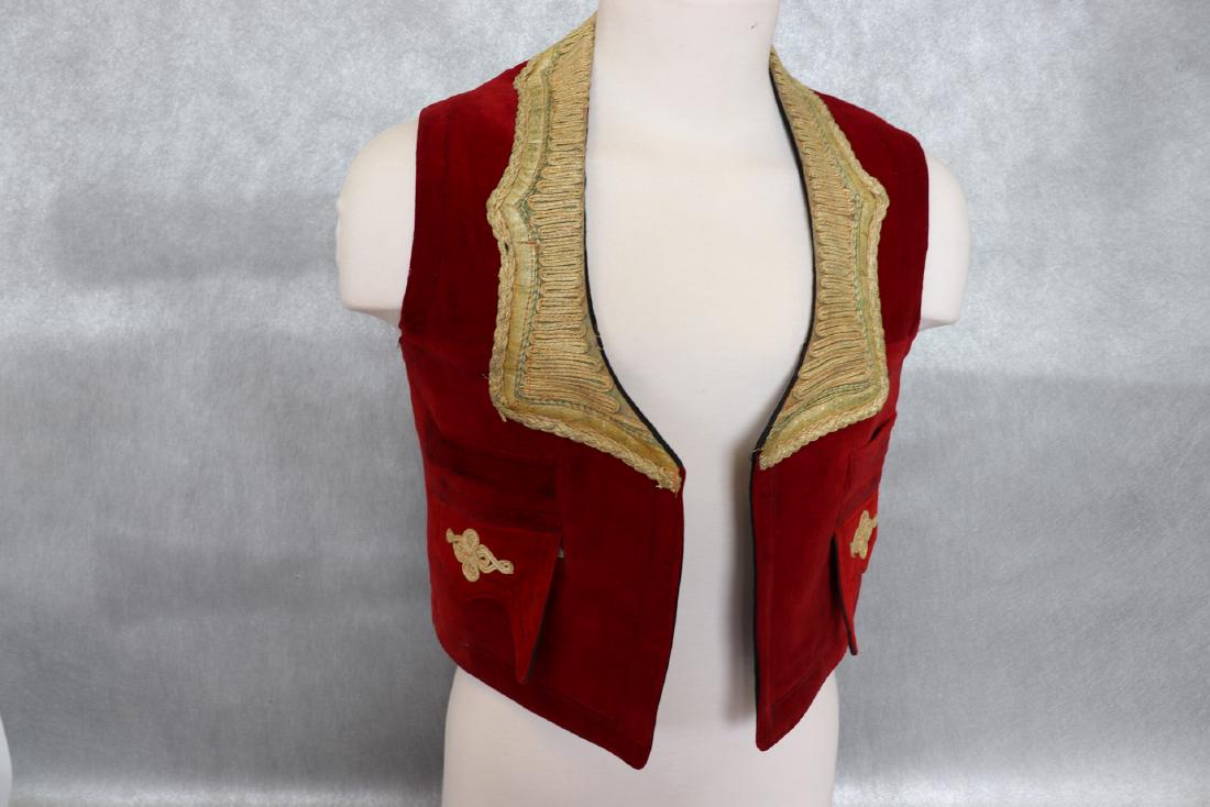 Early Men's Red Velvet Vest With Gold Braid, Mirrors: Red Velvet, fully lined vest with gold braid around neckline, on pockets and in back. Appliqued Gold detail with mirrors on the back. Hidden pockets inside - on both sides. Measures 36" at chest, 19" 