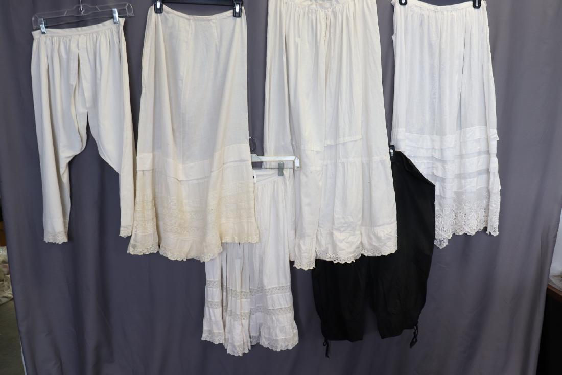 Lot of 6 Edwardian Bloomers, Petticoats: 2-bloomers; black silk taffeta bloomers with drawstring waist, labeled 1910, tattered at crotch, scattered pin dot holes. White bloomers 26" waist, knitted lace edging, very good. 4- petticoats; 24" t