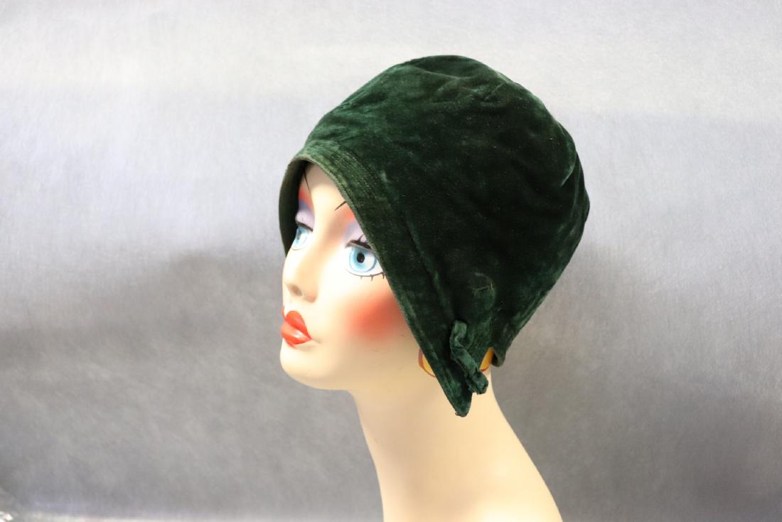 Antique 1920's Cloche Green Velvet Hat: Green velvet cloche hat, lined with silk taffeta. The lining has small breaks and needs to be tacked down in a 2" section. Otherwise in very good condition.