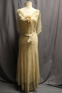 1930's Stunning Lace Gown: full length lace sleeveless V-neck with silk flower, fitted bodice with drop waist and mermaid bottom, matching lace that ties at waist and drape that comes from center of v neck draping over shoulder