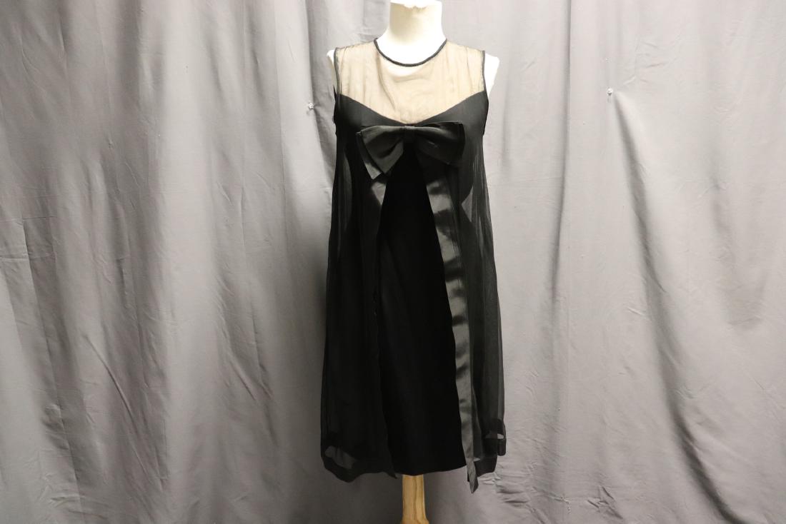 1960's Wiggle Dress with Shear Attached Cape: shear black attached cape with satin ribbon trim and large front bow, Baby doll style, union made label, good condition, slight wear under arms, see photo's, approx. 35 bust, 26 waist