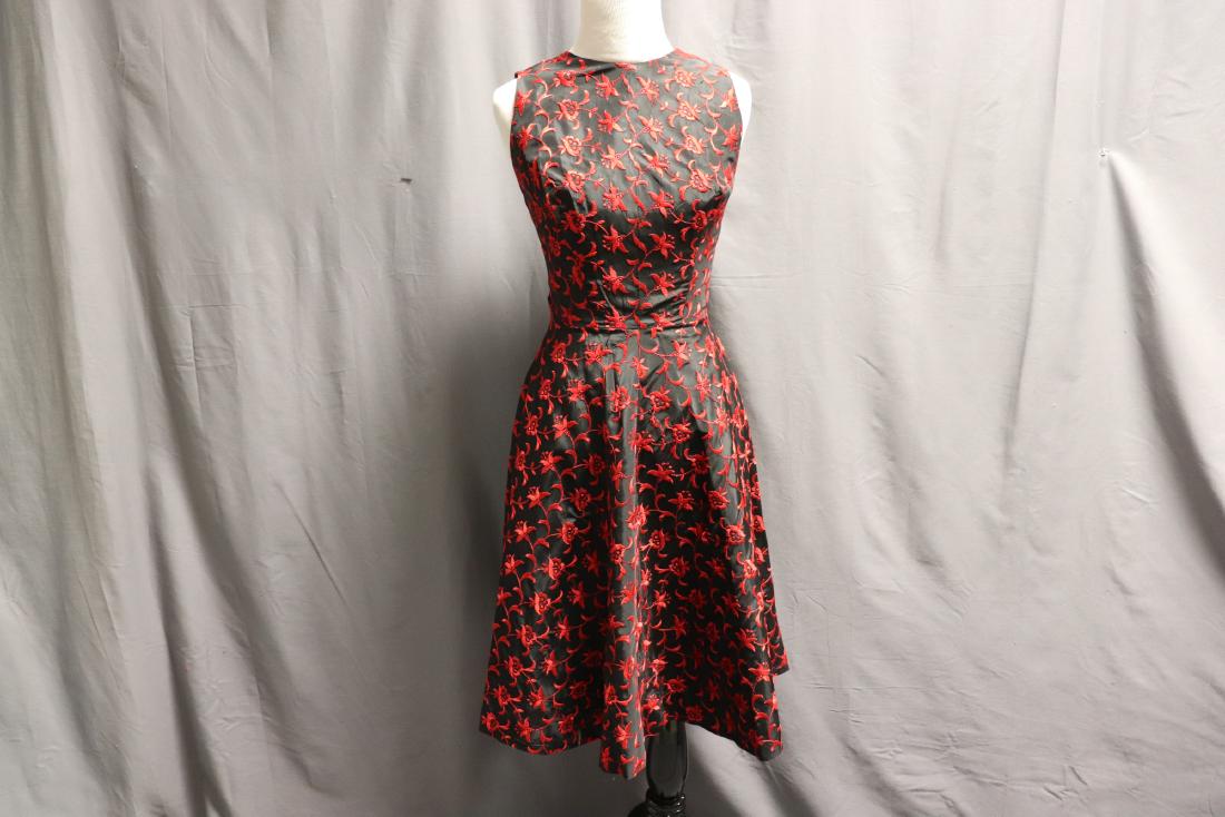 1950's Black & Red Embroidered Taffeta A Line Dress: sleeveless high scoop neck, embroidered in red on black, fitted bodice and flared skirt, low V in back with back zipper, great condition, a couple of pulled threads, approx. 35 bust, 22 waist