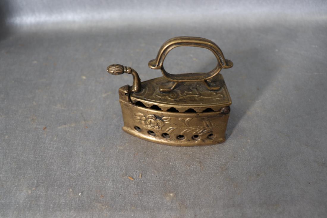 Vintage Brass Ornate Incense Burner: Raised floral design, shaped like an iron. Approx. 4" long x2" wide 4" tall. Great condition.