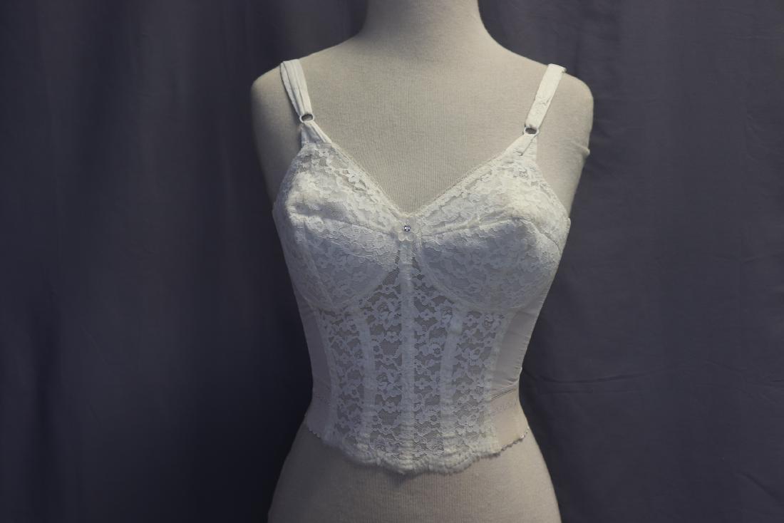 Vintage White Lace Bustier With Boning: Fully bone, adjustable back, band measures 25 1/2" around. Probably 34DD. In great condition.