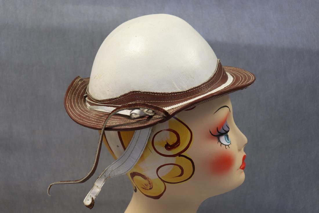 Vintage Rawhide Leather Gaucho Hat: Sturdy Rawhide bowl shaped women's hat. Rawhide detail on top of hat, straps with buckle hold the hat in place. Stamped size 7, inside measurement 20" circumference. In very good condition with light 