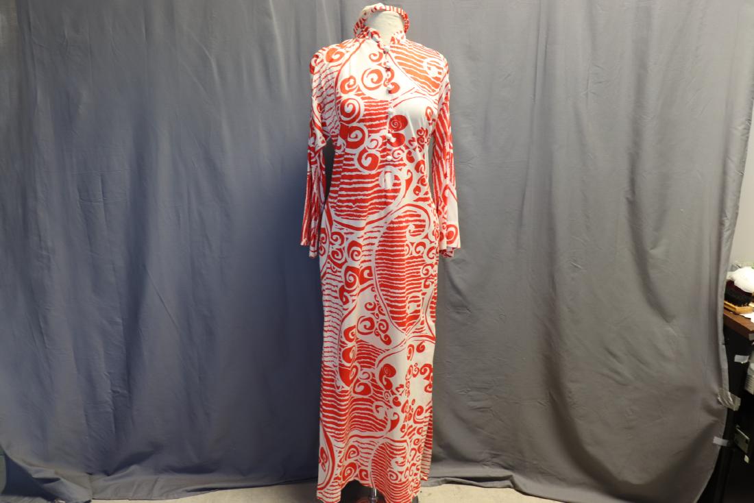 1970's Bergdorf Knit Maxi Dress: Bright orange swirls knit maxi dress has 6 round buttons, mandarin collar, side slit pockets, with headband Measures approx. 38" at bust, 36" at waist, 55" long. Made for Bergdorf Goodman, on the plaz