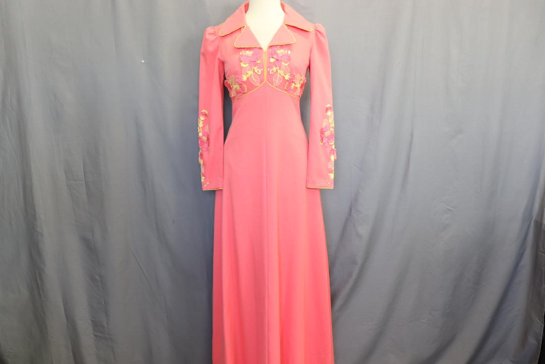 1970's Floral Applique Maxi Dress: Long Sleeves gathered at shoulders, convertible collar, peach poly blend with yellow piping, empire waist and slightly flared maxi skirt, back zipper, attached fabric floral applique, nice dress, see 