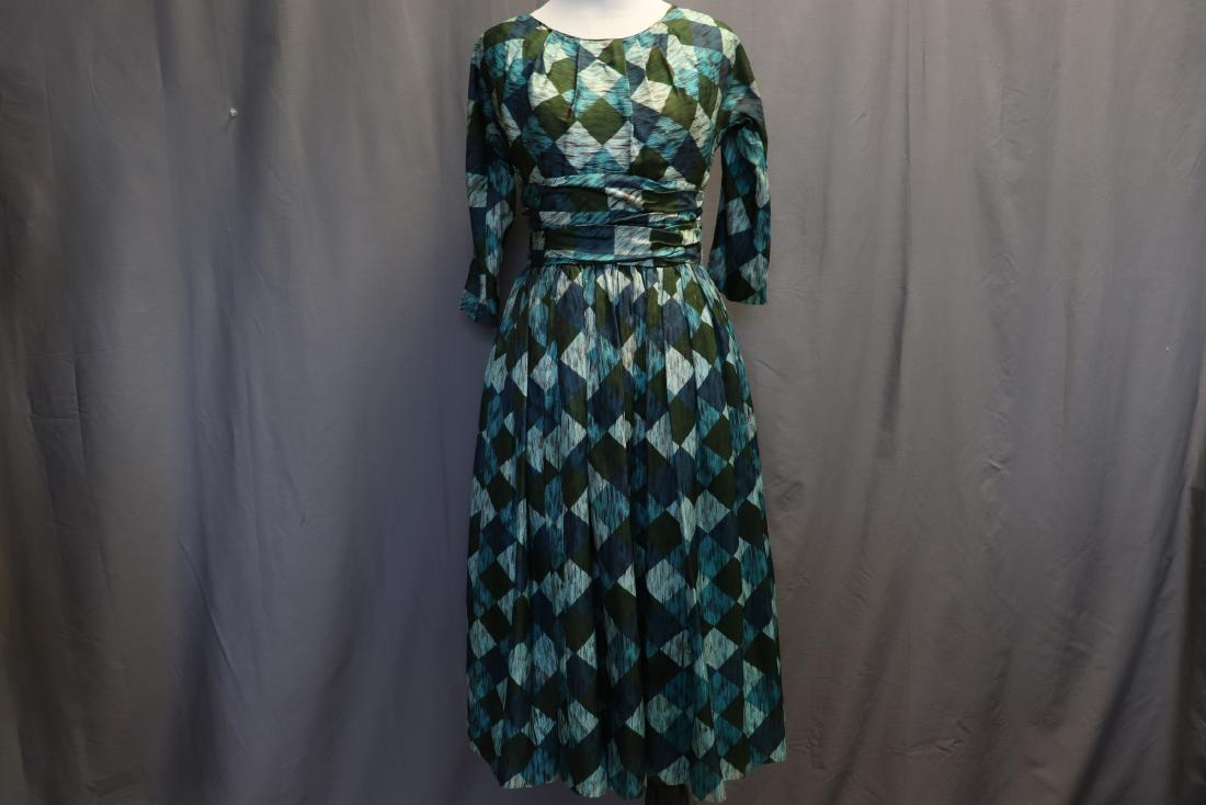 1950's Checkered Pouf Style Cocktail Dress: 3/4 dolman sleeves scoop neck with pleats, ruched band at waist, full gathered skirt, back zipper, nice condition, approx. 35/36 bust, 26 waist, silk blend