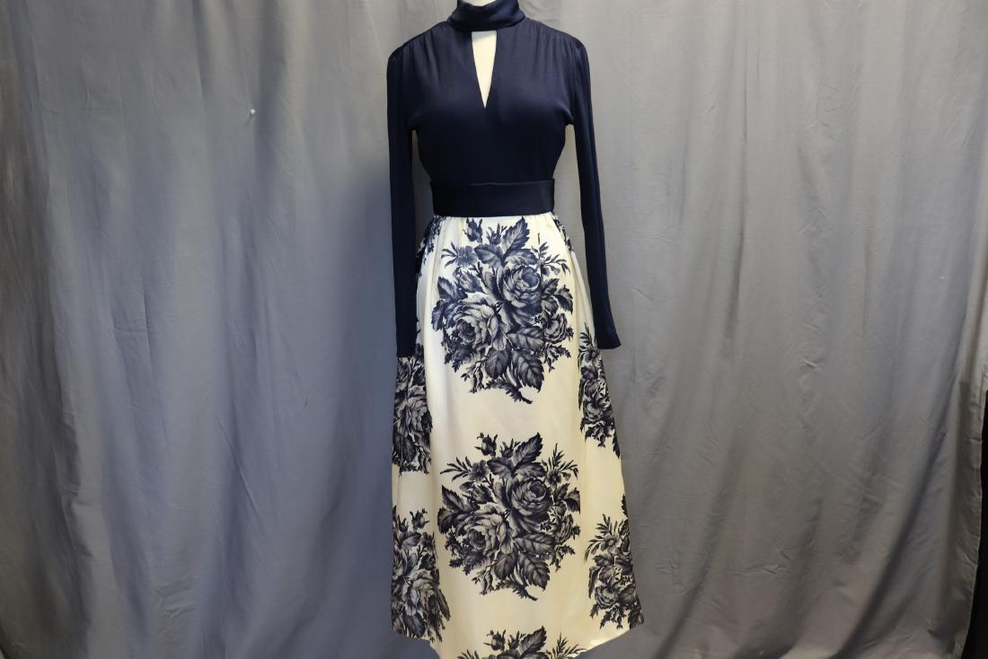 1960's Long Sleeve Satin Floral Print Maxi Dress: high collar with peek-a boo front, long sleeves, attached belt at waist, gathered satin maxi skirt with blue rose print, nice condition, seems to have been never worn, approx. 36 bust, 26 waist