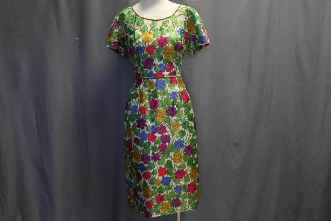 1960's Silk Floral Cocktail Dress: sheath dress short dolman sleeves, scoop neck with sheer fabric and applique & velvet trim, velvet piping at waist with bow in back, back zipper, skirt with darts, approx. 38 bust, 30 waist, shear sil
