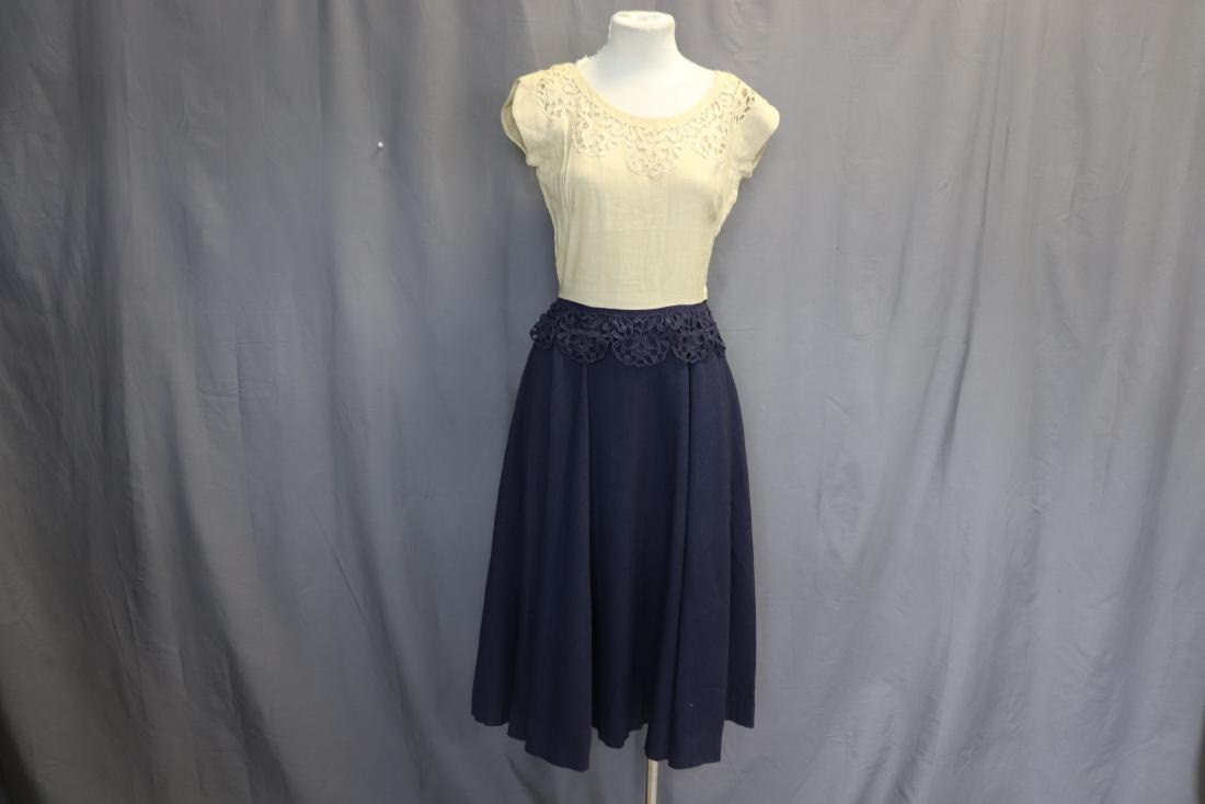 1950's Fit & Flare Dress by Carlye: scoop neck with cut out lace, sleeveless bodice with double darts for breasts, side zipper, full circle skirt with attached cut out lace at waist, see photo's for faded spot on skirt hem, approx. 35 b
