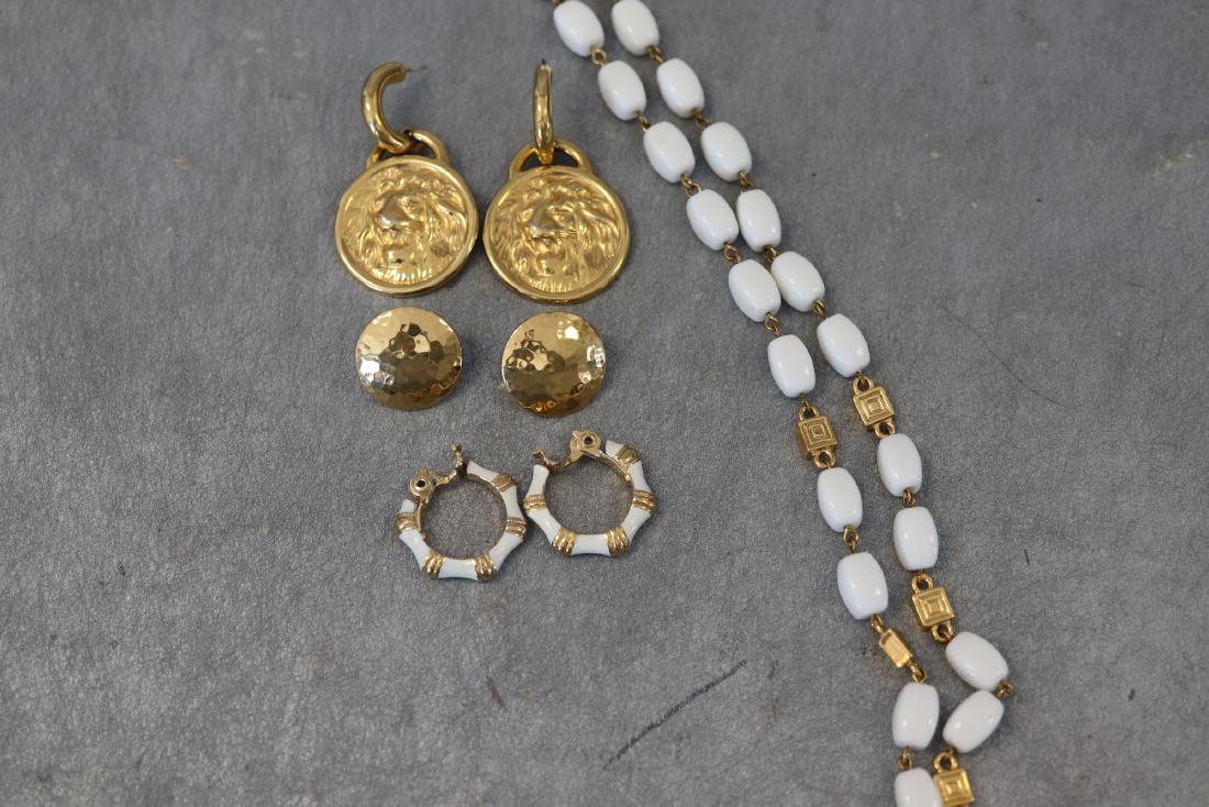 Monet Earrings, Lion Earrings, White Necklace: 2 Pair earrings marked Monet, both are clip-on. The lion earrings are pierced, missing the backings. White acrylic beaded necklace. All in great condition.