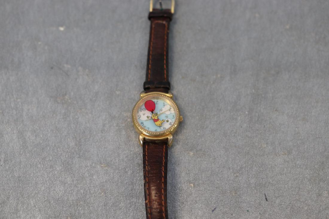 Vintage Winnie The Pooh Wrist Watch: Winnie The pooh swivels. Marked Genuine leather wrist band, made exclusively for the Disney Store. Band show a little wear but overall in very good condition.