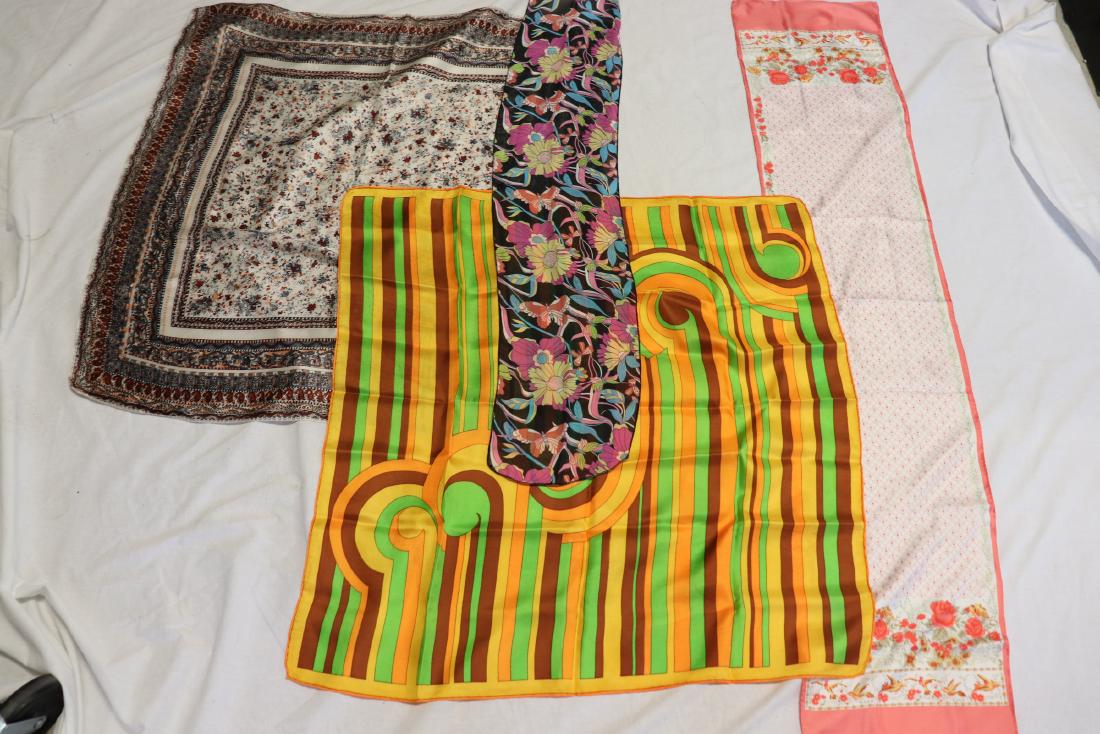 Lot of 4 Vintage Scarves: Peach floral silk scarf 10x54", rolled edges, made in Italy.. Large 31x32", silk India print, rolled edges. Jewel tone 8x42"; silk orange, and green 1970's style, 29x30"- All in great condition.