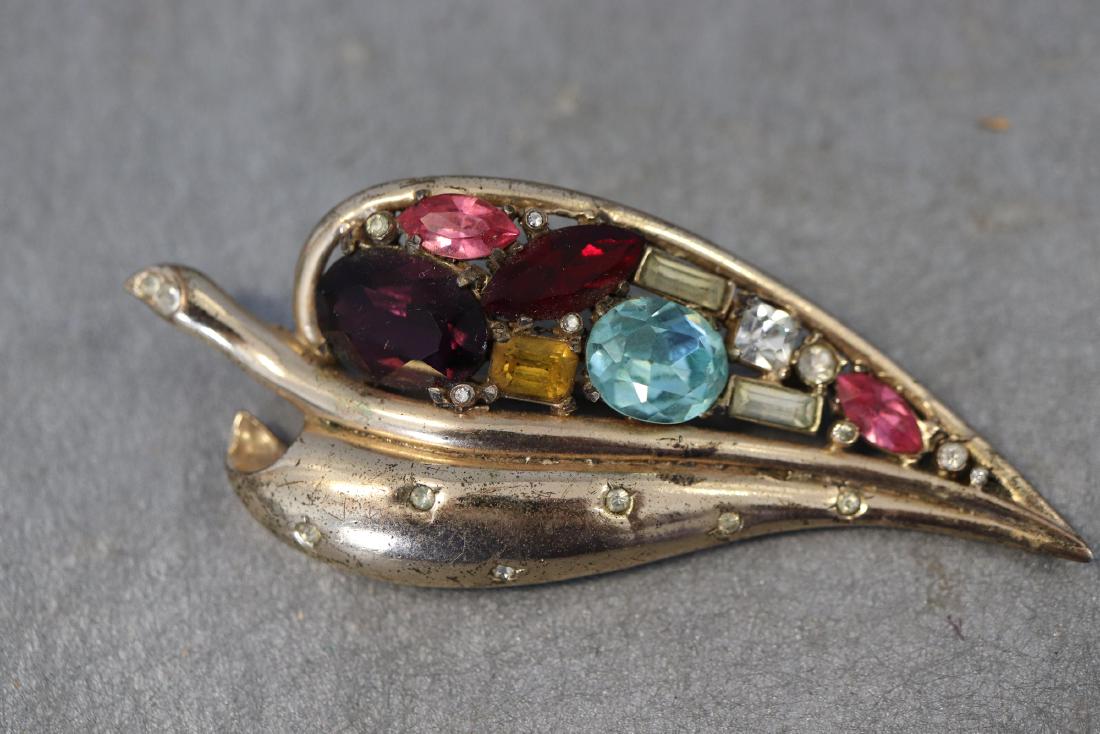 Vintage Sterling Coro Gold Tone Brooch: Leaf design, blue, red, pink, clear stones, 3 1/4" long. Great condition.
