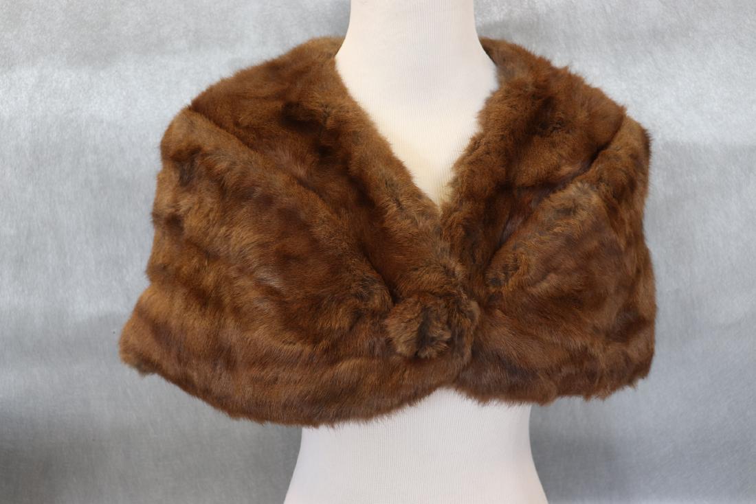 Vintage Light Brown Mink Stole: Labeled Wm. H. Harris, monogrammed ESD, measures 51" along bottom edge, 13" deep. Satin lined, one self-covered button in front. Great condition.