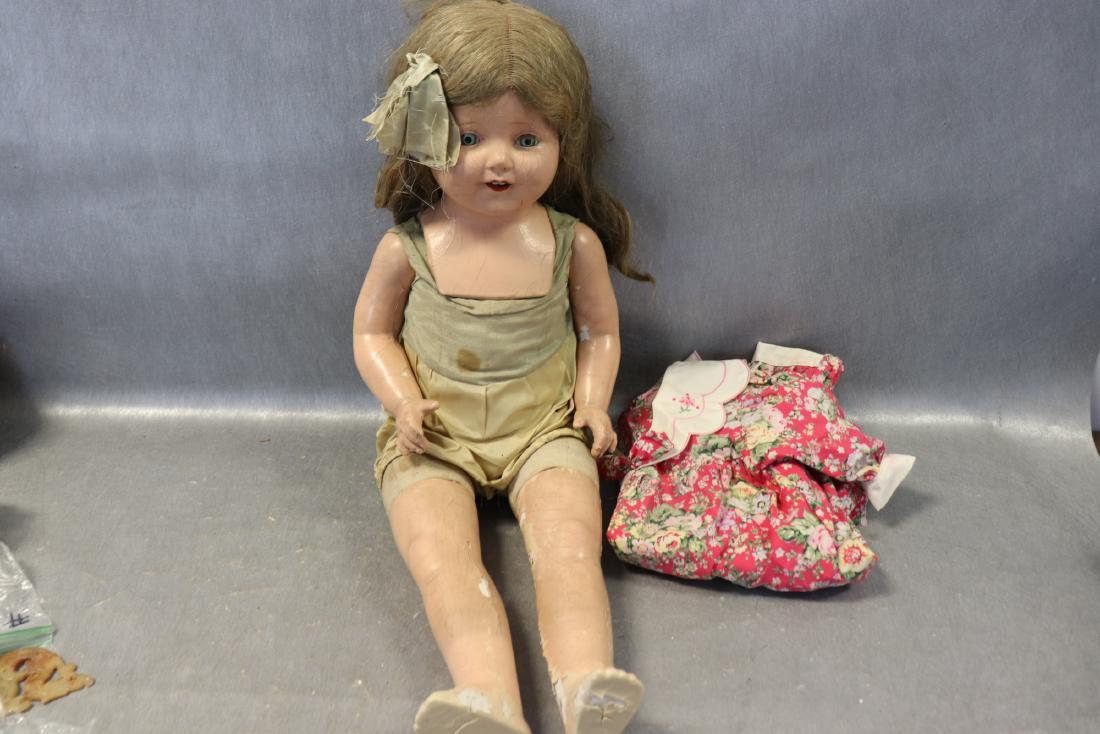 Antique 25" Composition Doll: Sleepy eyes open and close, open mouth with teeth, cloth body, speaker inside (not functional). Needs some restoration with cracking and peeling on arms, legs and face.
