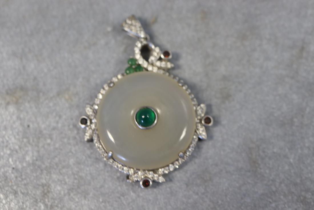 Jade Pendant with Sterling: white jade with green center, silver frame marked s 925