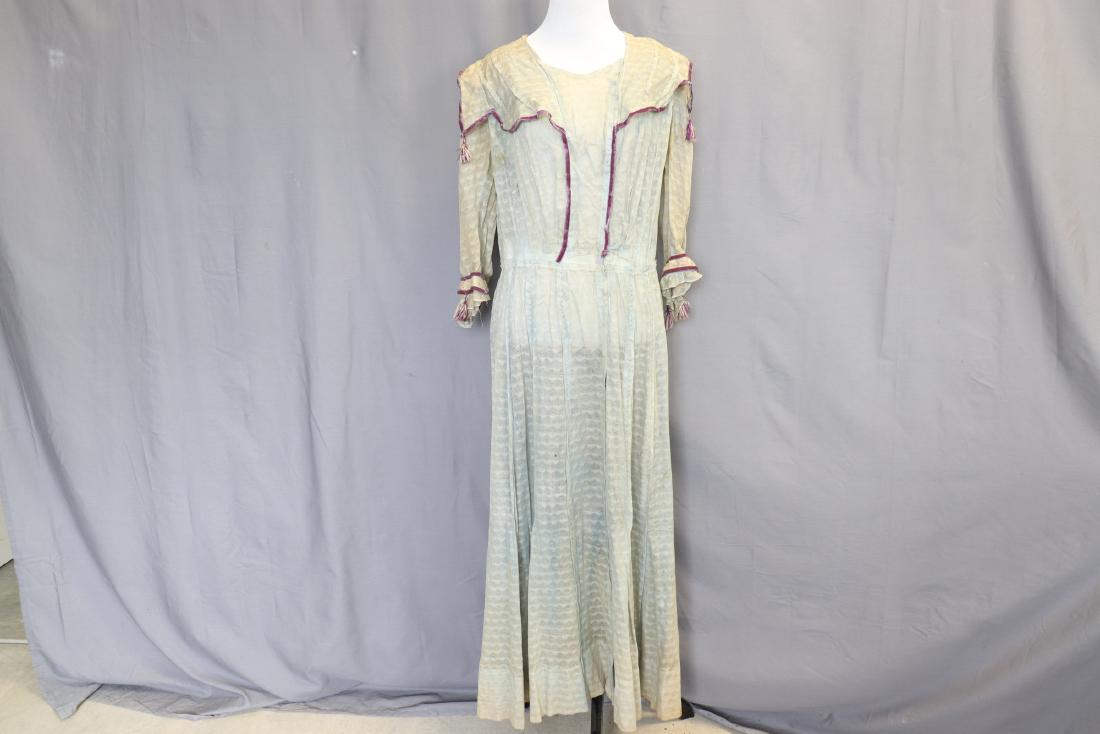 Early 1900's Day Dress: very faded light blue with purple velvet trim, sailor style collar, 3/4 sleeves, hand knotted detail, missing sash or ribbon belt, soiled and some damage, approx. 40 bust, 30 waist