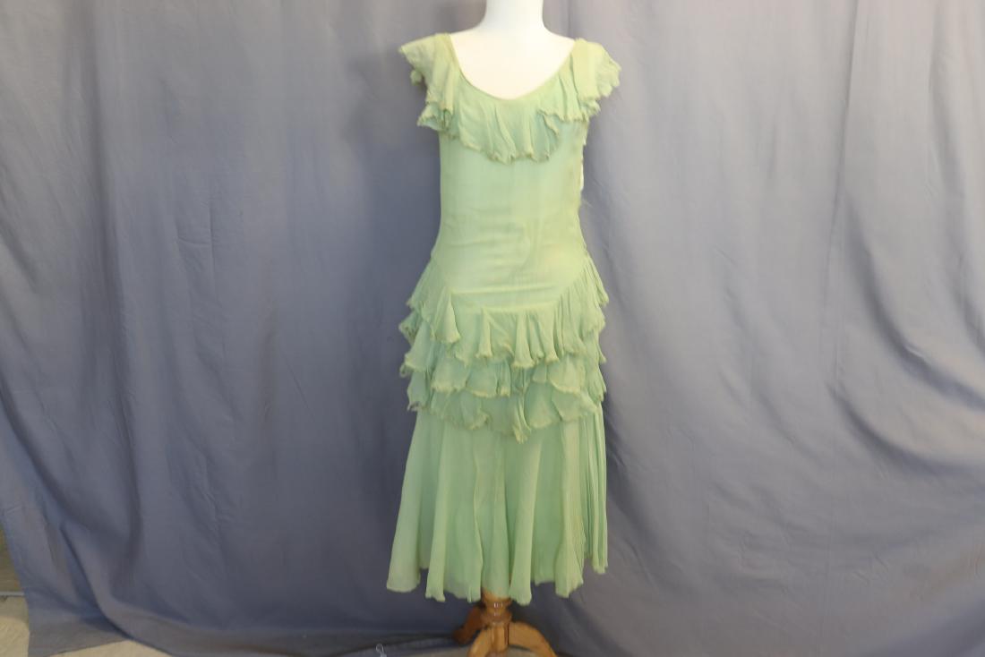 Vintage 1930's Green Chiffon Evening Dress: Silk Chiffon, side snaps, drop waist, self ruffles at neck and on skirt. Rayon liner dress (some seam repair needed). Underarm soil, light soil on dress, rips in under dress and on dress near snaps, u