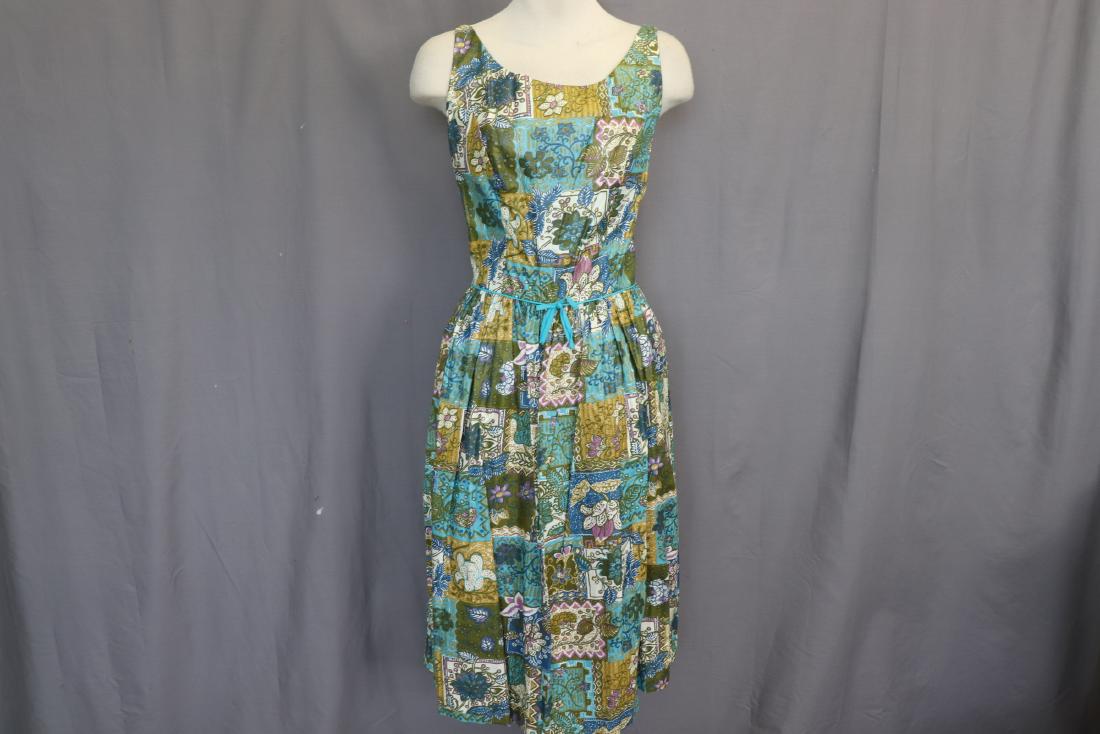 1950's Old Store Stock Polished Cotton Pouf Dress: sleeveless scoop neck, sits at waist full gathered pouf skirt, great polished cotton floral print, back zipper, original tags, approx. 38 bust, 28 waist