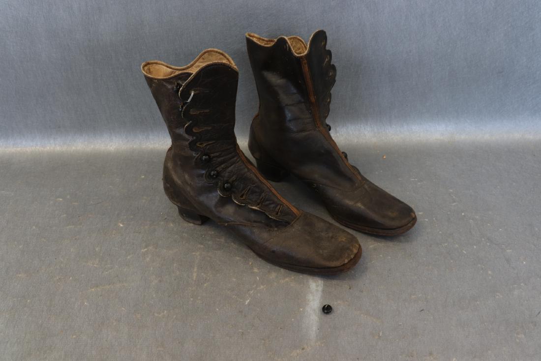 Antique Victorian Children's Leather Shoes: Button up leather shoes, sticker on heal is dated 1860. Some buttons missing, leather and cloth lined, 1" heel, approx. 8 1/2" long. Some scuffs, see photos.