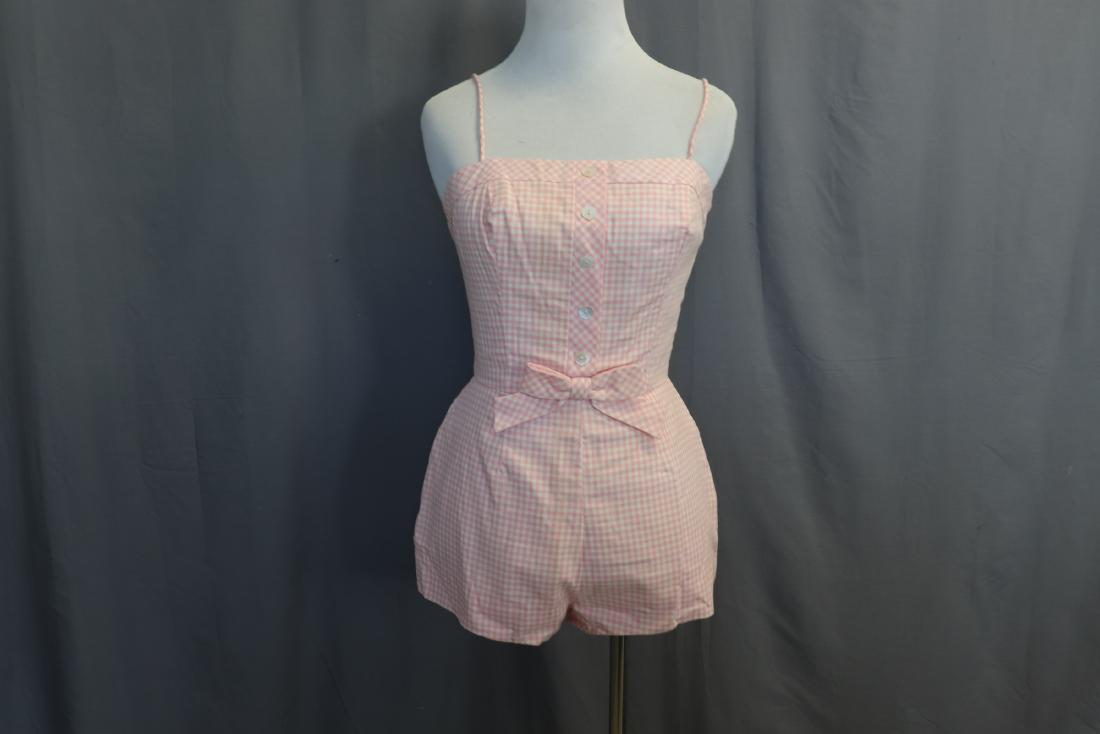 Vintage 1960 Lanz Pink Gingham Bathing Suit: Spaghetti straps, metal zipper in back, muslin lined, boned bodice, shell buttons, elastic leg openings. No sign of wear, good condition. Measures approx. 32" bust, 22" waist, 20" long. See the Pink K