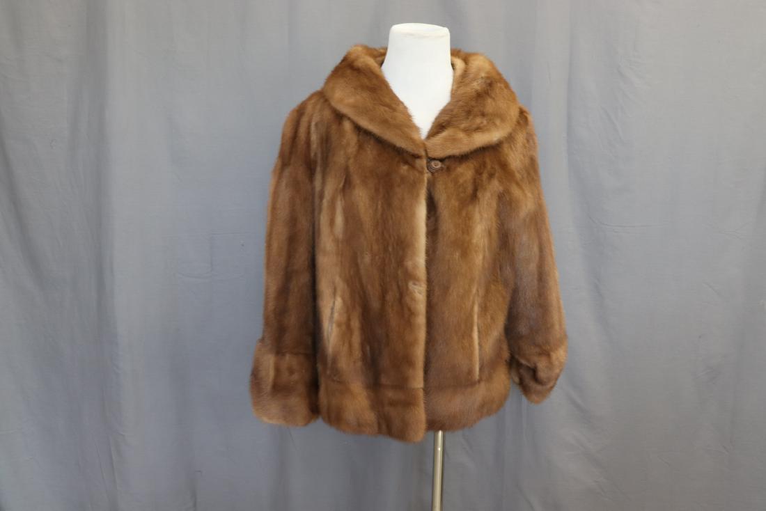 Vintage Evan's Furs Mink Jacket: Lined, one covered button in front neck, hook & eye by waist, two front pockets, measures approx. 38" at bust, 23" long. Great condition.
