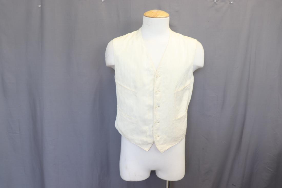 Edwardian Men's White Waistcoat Vest: Four front pockets, fully lined with cotton, outer fabric is textured, 5 shell buttons down front. Approx. 40" at chest, 23" long. Great condition.