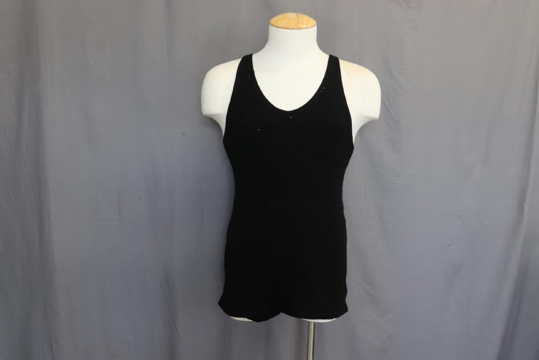Men's Antique Black Wool Bathing Suit: Measures 34" at chest, approx. 11" across shoulders, 28" long. Some small holes in the wool. Otherwise, good condition. Tag on shoulder strap - " NRA, Made Under Knitted Outerwear Code Authority".