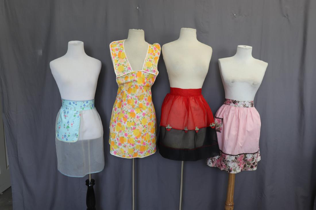Lot of 4 Vintage Aprons: 3 half aprons, approx. 16 across waist, 19 long. One full, approx. 21 across waist, 29 long. All in good condition.