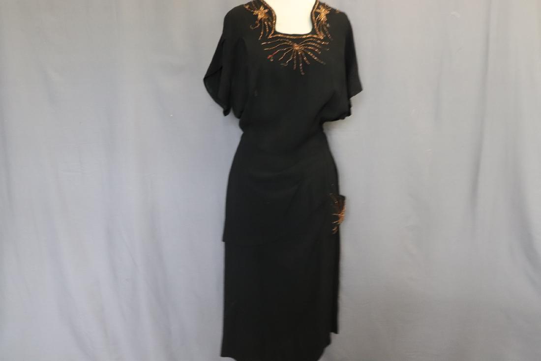 1940's Beaded Black Asymmetric Dress: wrap style sleeves, fancy square neckline with beading (some bead lose), sits at waist with left side drape and beaded pocket, side zipper, see photo's for stains, approx. 44 bust, 32 waist